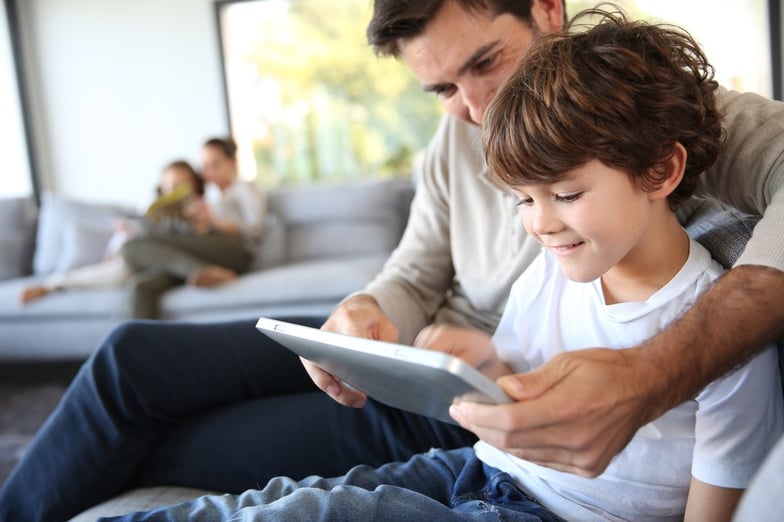 Father and son playing with digital tablet.jpeg